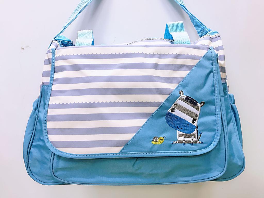 eb7ac65f-5641-4ffb-b1f9-cc33d474618c.jpg Bolso celeste cebra - Imagen 1